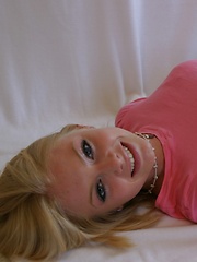 Super cute Skye poses for pictures in a tight pink shirt and grey sweat capris