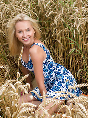 New model Bernie strips in the wheat field as she bares her delectable   body.